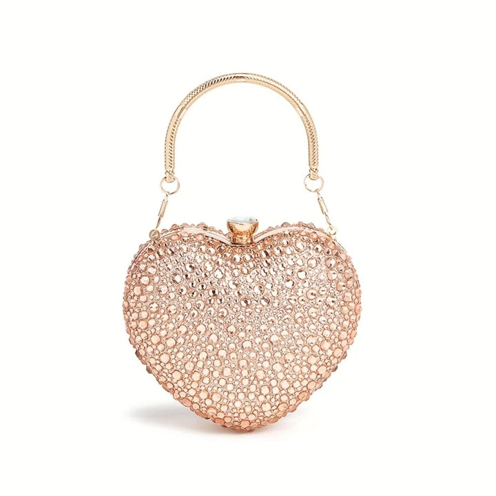 Bolsa de festa clutch Feminina Champagne em formato de coração, cravejada com cristais azuis vibrantes, alça metálica dourada estruturada e fecho superior com detalhe em pedra – loja Bolsa Clutch