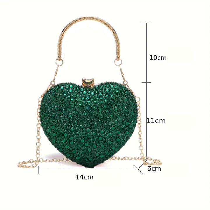 Medidas externas da Bolsa clutch festa Verde em formato de coração, cravejada com cristais azuis vibrantes, alça metálica dourada estruturada e fecho superior com detalhe em pedra – loja Bolsa Clutch
