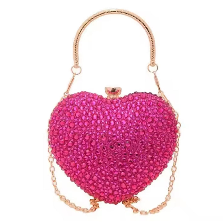 Bolsa  de festa clutch Feminina rosa em formato de coração, cravejada com cristais azuis vibrantes, alça metálica dourada estruturada e fecho superior com detalhe em pedra – loja Bolsa Clutch